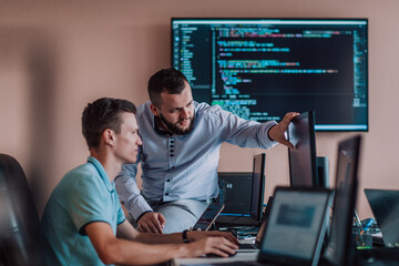 Programmers engrossed in deep collaboration, diligently working together to solve complex problems...