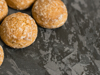 Delicious gingerbread cookies close-up on dark table, background with copy space.