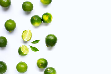 Fresh limes with leaves isolated on white