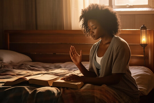 African-american girl praying with a bible on her hands and candles..Image ai generate Image ai generate