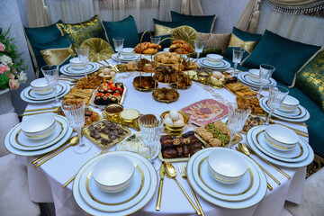 Moroccan Algerian breakfast table. Vintage background with different plates with delicious traditional middle eastern food