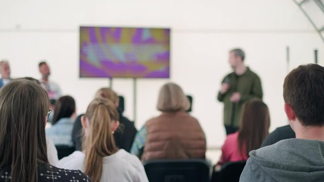 Man giving presentation for audience during seminar