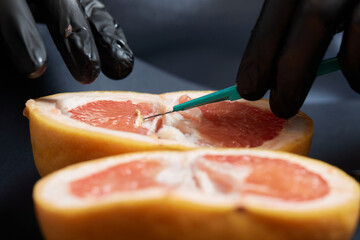 Food testing in the laboratory. The lab technician prepares a sample for microscopic examination.