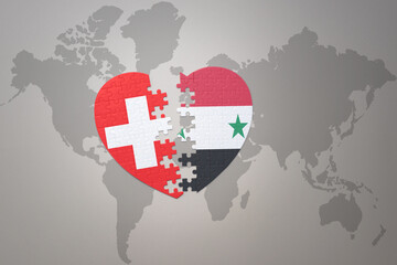 Fototapeta premium puzzle heart with the national flag of syria and switzerland on a world map background.Concept.