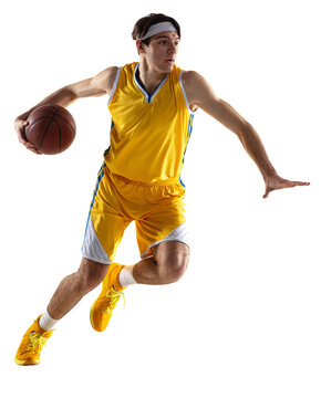 Sportive young man, professional basketball player training with basketball ball isolated over transparent background.
