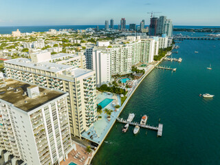 Naklejka premium Aerial photo waterfront condominiums in Miami Beach circa 2023