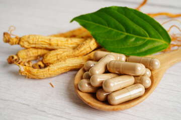 Ginseng roots and green leaf, healthy food.