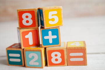 Number wood block cubes for learning Mathematic, education math concept.