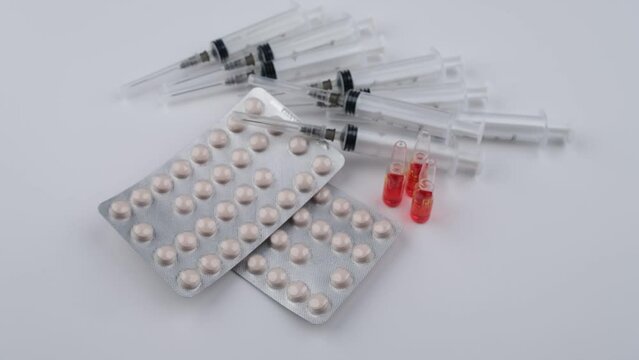 syringe and pills