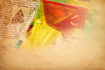 Tibetan prayer flags vintage background with copy space. The prayer flags are used to promote peace, compassion, strength, and wisdom. 