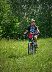 nice active senior woman on a bike tour with their electric mountain bikes in the Karst Mountains of Slovenia near Solkan