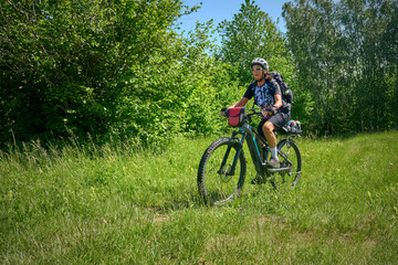 Fototapeta na wymiar nice active senior woman on a bike tour with their electric mountain bikes in the Karst Mountains of Slovenia near Solkan
