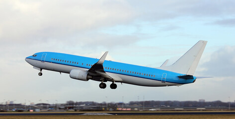 Blue plane taking off 