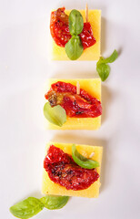 festive canape- polenta with dried tomato and basil