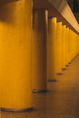Yellow pillars in subway