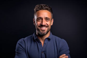 Fototapeta premium Headshot portrait photography of a satisfied boy in his 30s giving a hug to the camera against a deep indigo background. With generative AI technology