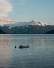 Fototapeta premium lake in the mountains. boat in a lake. volcano. winter.