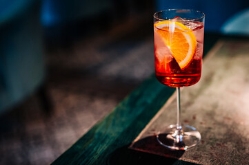 alcoholic cocktail in a glass stands on a table in a bar or restaurant