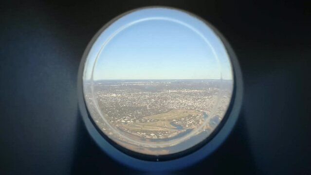 Panoramic view of New York from plane porthole window. Handeld