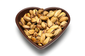 Heap pistachios isolated on white background, close up.