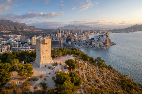 Aerial view of Torre d'Aguil&oacute; with Benidorm (Alicante, Spain) in the background.