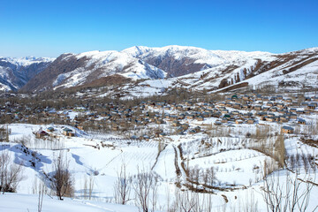 Village in the mountains against the backdrop of winter
