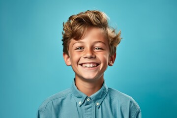 Lifestyle portrait photography of a happy kid male smiling against a cerulean blue background. With generative AI technology