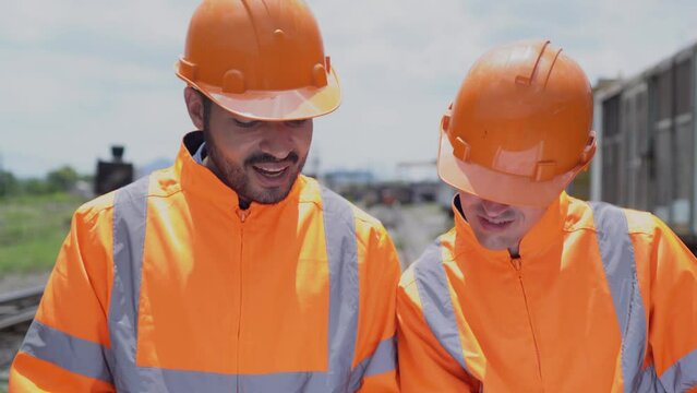 workers at work. Service engineer of train. Worker analysis and discuss job on railway.	