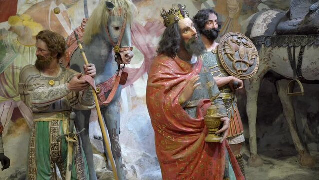 Terracotta sculptures of the arrival of three wise men Magi in Bethlehem on a biblical character scene representation from a chapel of famous Sacred mountain of Varallo, an Unesco world heritage site
