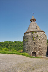 Fototapeta na wymiar Old stone medieval Potter Tower in Kamianets-Podilskyi fortress, Ukraine.