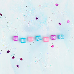 Colorful UNICORN beads text typography
