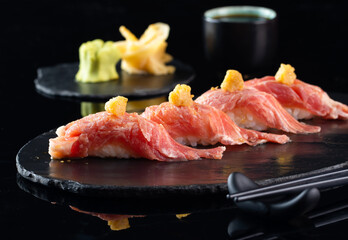 Sushi of Japanese, Salmon Roll Sushi. Collection of sushi on dark background, sushi is a Japanese favorite, Japanese food