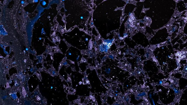 Abstract marble liquid glitter paint. Space concept. Dark and blue inks in oil.