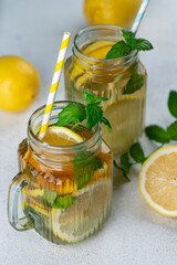 Lemonade with lemon slices, ice and mint leaves