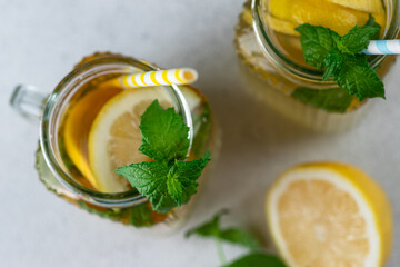 Lemonade with lemon slices, ice and mint leaves