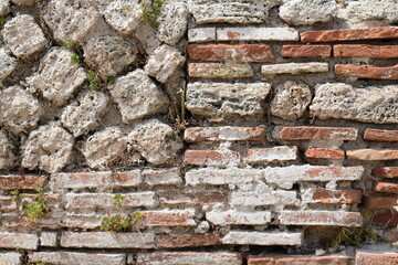 Ancient Roman composite wall masonry building technique opus vittatum, also called opus listatum, with bricks and stones.