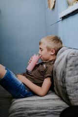 Fototapeta premium child sitting on a chair