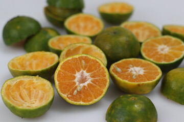 Fototapeta na wymiar Half sliced Nagpur oranges along with a bowl of black chia seeds