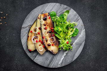 eggplant dish tomato, pepper, green leaves fried vegetable snack on the table copy space food background rustic top view