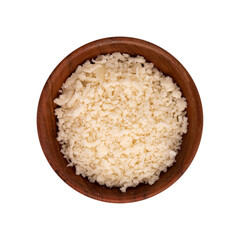 grated cheese parmesan in wooden bowl isolated on white background, top view of hard granular cheese, italian food