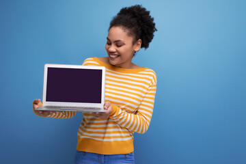 pretty afro brunette latin young office woman holding laptop