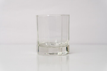 Refreshing Drink in Transparent Glass on White Background