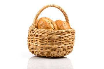 bread in wicker basket isolated on white