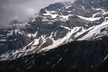 Rocky mountains with patches of snow in the Swiss Alps