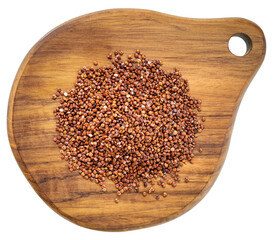 gluten free red quinoa grain on a mini wooden cutting board isolated on white