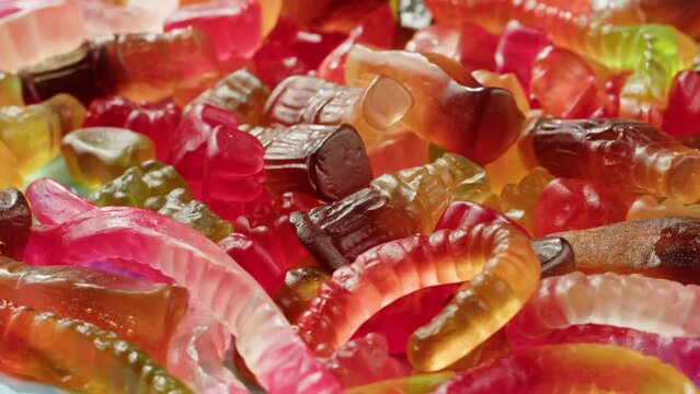 Jelly marmalade cola bottle bear close up, Confiture Bean candy jujube Marmalade bears with cod cannabis close up. 