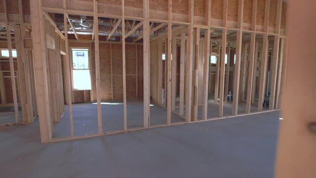 New Southwest Home Construction Interior Framing Walk Through In Between Walls. slow motion view in home construction framing interior move through and between wall studs