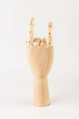 Wooden hand isolated on a white background. Copy space