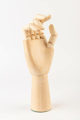 Wooden hand isolated on a white background. Copy space