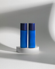 A mockup of cream tube, cosmetics in minimalism style on white background